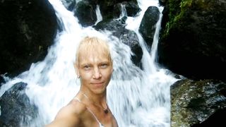 Alexa Cosmic swimming in cool waterfall dressed in colorific combi sundress...