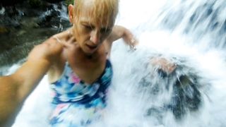 Alexa Cosmic swimming in cool waterfall dressed in colorific combi sundress...