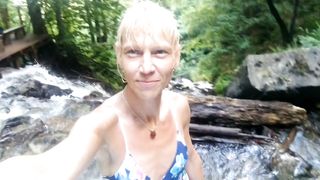 Alexa Cosmic swimming in cool waterfall dressed in colorific combi sundress...