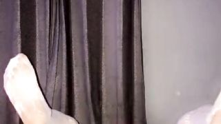 Sissy mega-slut clothed up on her back using black faux-cock