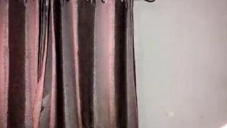 Sissy mega-slut clothed up on her back using black faux-cock