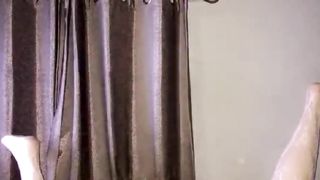 Sissy mega-slut clothed up on her back using black faux-cock