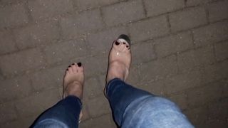 crossdresser entices with her uber-sexy soles in stripper footwear on the street