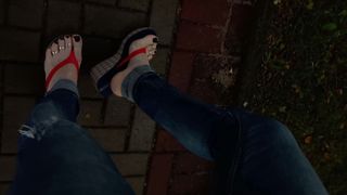 a crossdresser with magnificent soles in spin flops is provocative on the street