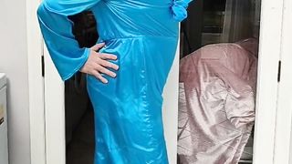 Warm crossdresser in total satin jumpsuit