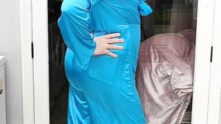 Warm crossdresser in total satin jumpsuit