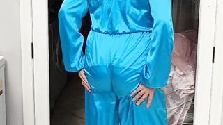 Warm crossdresser in total satin jumpsuit