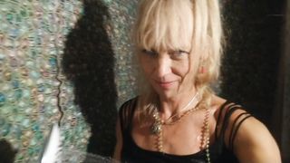 Wetlook in douche in black fishnet bod, jeans cut-offs and high high-heeled shoes boots