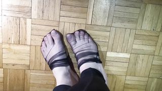 Toes dancing in black nylons