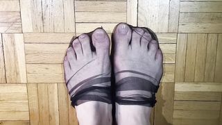 Toes dancing in black nylons