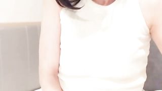 Asian crossdresser strokes while gawping at the camera