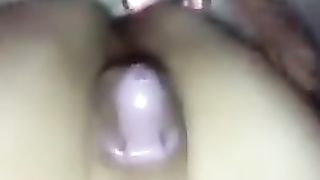 Whorish femboy dolled up on her back locked in purity and frolicking with her arse buttplug