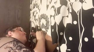 PLUS-SIZE SHE-MALE FELLATES ANONYMOUS BIG BLACK COCK THRU GLORYHOLE