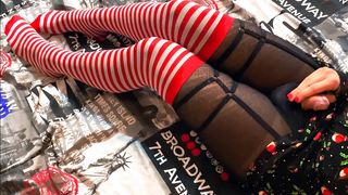 Trans Christmas Elf paws herself with a hitachi