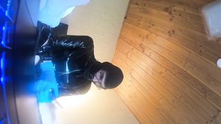 him in a latec catsuit