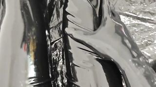 Spandex femboy dressed in a gas mask wears shoes and displays his breath bottles