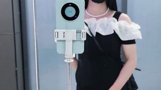 Chinese t-model in black cock-squeezing microskirt finishes off at the door of public rest room