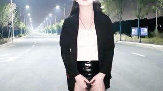 Chinese she-male wanks and finishes off in the middle of the road