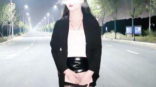 Chinese she-male wanks and finishes off in the middle of the road