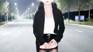 Chinese she-male wanks and finishes off in the middle of the road