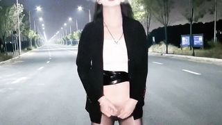 Chinese she-male wanks and finishes off in the middle of the road