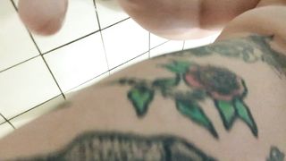 Fatty ladyboy plays with large white faux-cock in shower