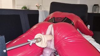 Crimson Enclosed Damsel Bangs Itself with Fuckmachine