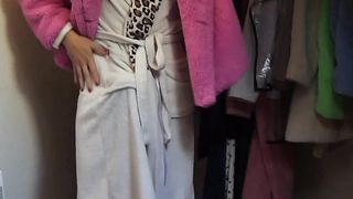 Ladyboy in high-heeled slippers and robe