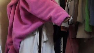 Ladyboy in high-heeled slippers and robe