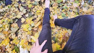 Femboy draining off outside in the fall leaves