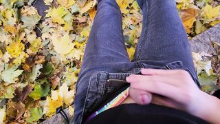 Femboy draining off outside in the fall leaves