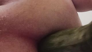 Obese handballing with zucchini in the bathtub