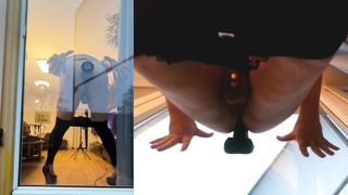 Sissy in Leggins toying with Faux-cock on balcony