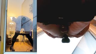 Sissy in Leggins toying with Faux-cock on balcony