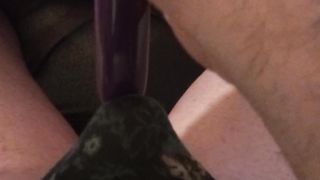 Am toying with my massager while dressed in pantyhose