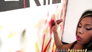 Ebony tranny sucks and jerks off two cocks at gloryhole