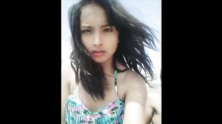 Teenage She-Creature being pretty with her cellphone