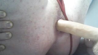sissy tucking her crevice with fake penis