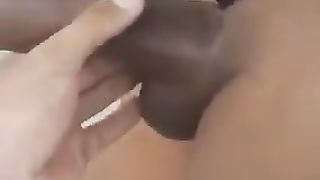 Guy kneading a semi-bare ebony trans chick in public