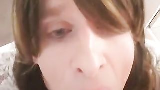 sissy deep-throating a faux-cock