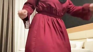 Fatima dancing in hotel room