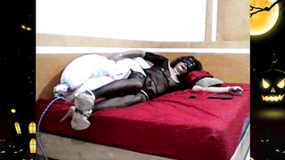 Torrid Halloween, lounging down, the black kitten gets pulverized