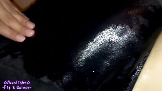 Dark blue bathing suit with greasy lotion!