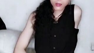 Gothic gal jacks and plays with her butt.