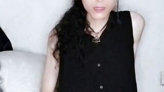 Gothic gal jacks and plays with her butt.