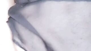 Gothic gal jacks and plays with her butt.