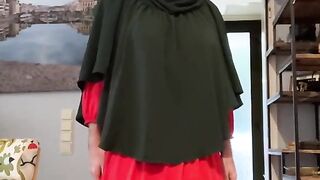 Fatima in red dress and green Khimar