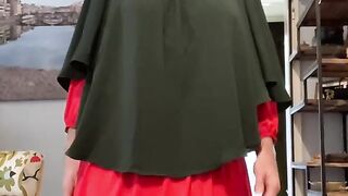 Fatima in red dress and green Khimar