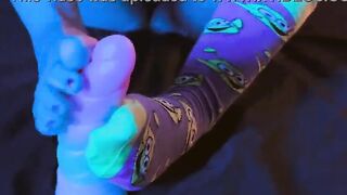 Dressed in themed socks, I'll entice you with my pallid soles and dark-painted toenails.